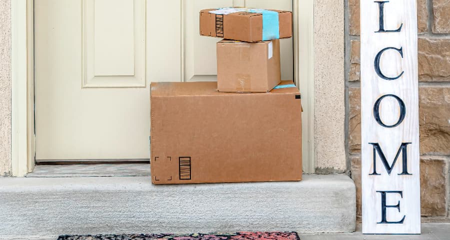 Deliveries on the front porch of a house with a welcome sign in West Lafayette